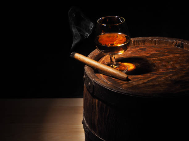 istock Cognac and Cigar on old oak barrel 640186160