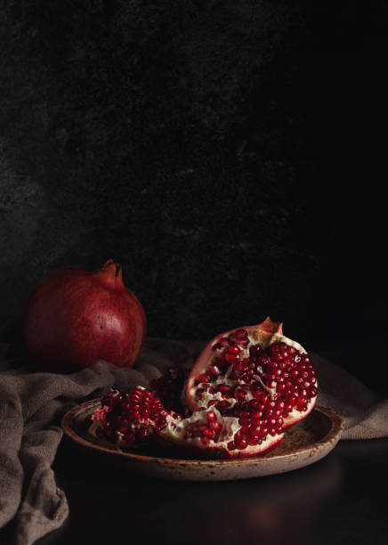 istock Still life with red juicy pomegranates 640187764