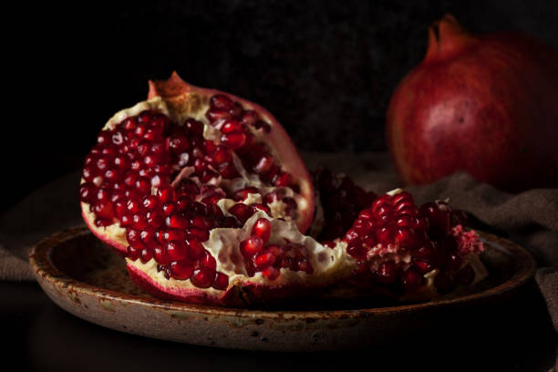 istock Still life with red juicy pomegranates 640187770