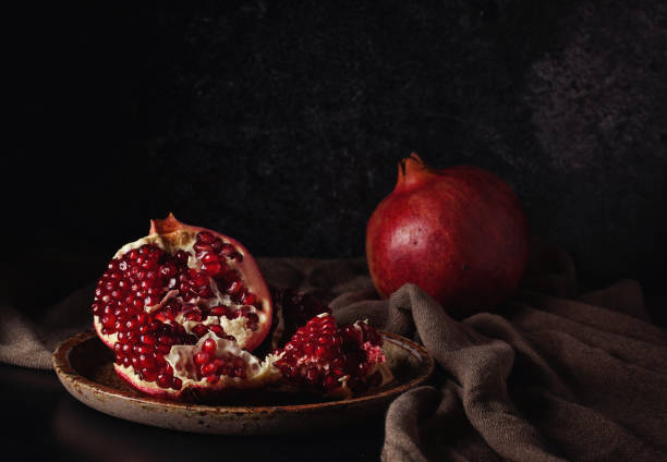 istock Still life with red juicy pomegranates 640187800
