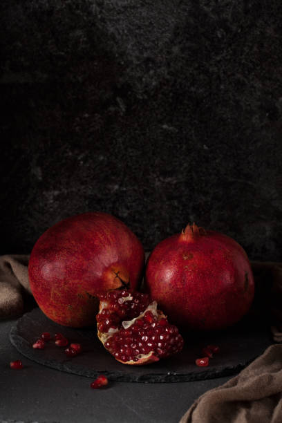 istock Still life with red juicy pomegranates 640187818