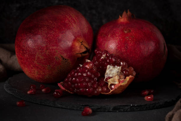istock Still life with red juicy pomegranates 640187830