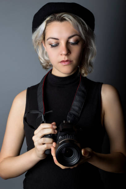 istock Female Photographer with DSLR Camera 640187920