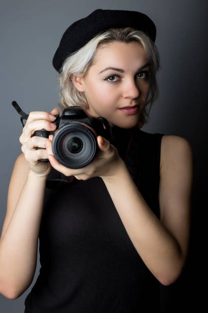 istock Female Photographer with DSLR Camera 640188048