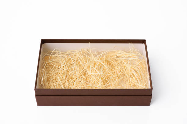istock Opened brown box with cushioning material on white background 640189278