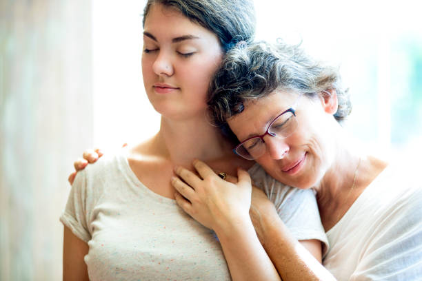 istock Happy mother resting on shoulder of daughter 640189746