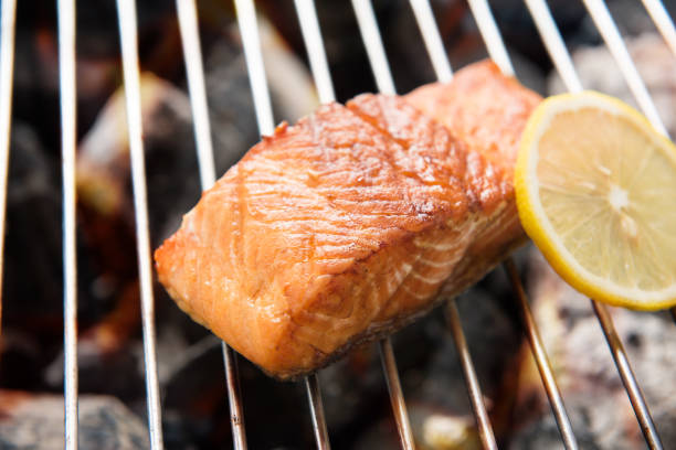 istock Grilled salmon with lemon on the flaming 640190648