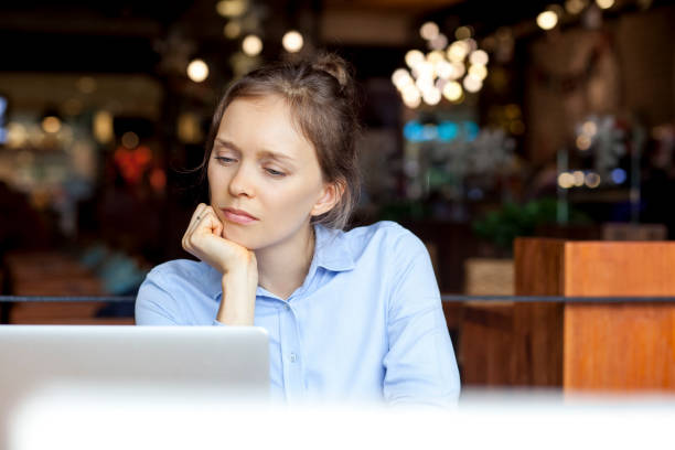 istock Concentrated woman reading business article 640191092