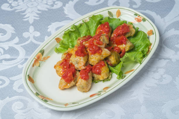 beautifully cooked cabbage rolls on plates stock photo