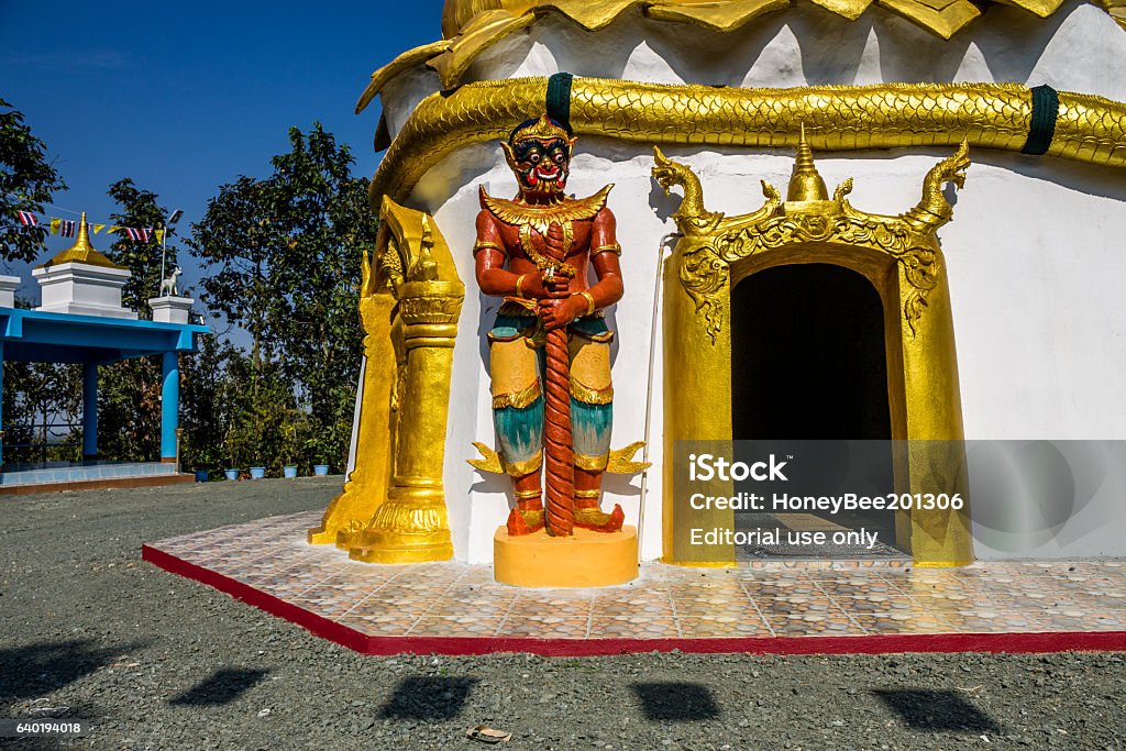 Thai traditional imaginary guardian Chiangmai, Thailand - January 19, 2017: Thai traditional imaginary guardian was located in front of entry way for symbolize to protection from evils in Buddism beliefs. Architecture Stock Photo