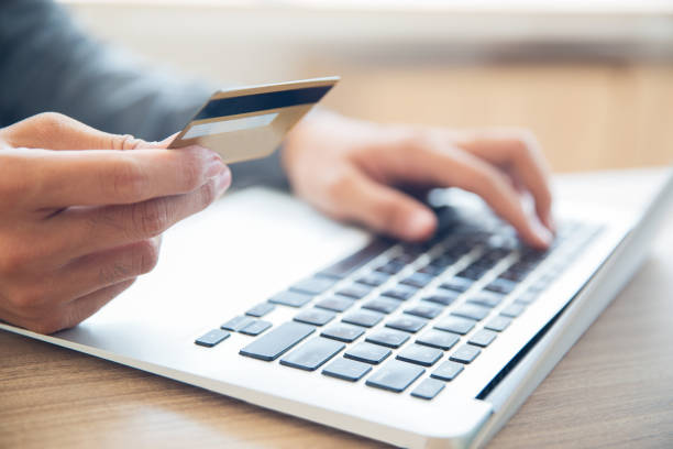 istock Man making online purchase with credit card 640194268