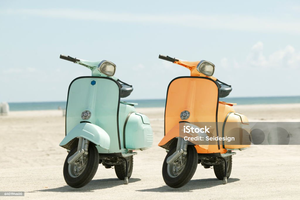 Two scooters on a beach Motor Scooter Stock Photo