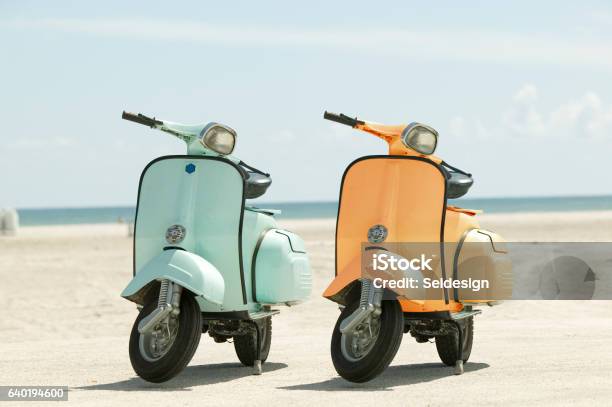 Two Scooters On A Beach Stock Photo - Download Image Now - Motor Scooter, Beach, Two Objects