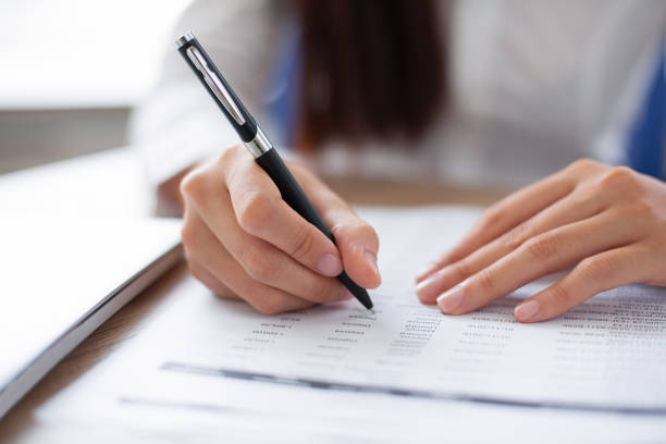 istock Closeup of Business Person Working with Document 640195664