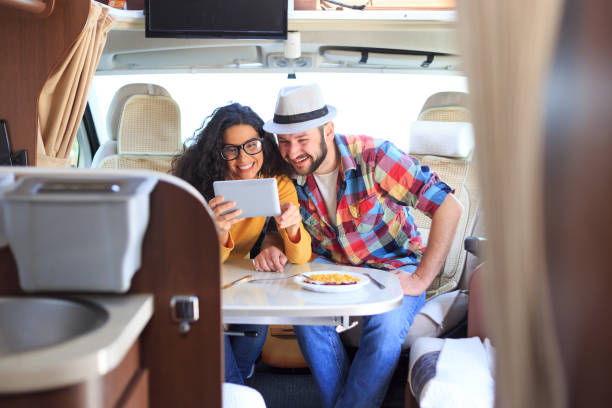 istock Smiling couple making selfie inside of a camper 640197300