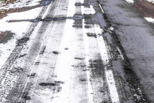 istock Winter road texture, tire tracks in snow 640199076