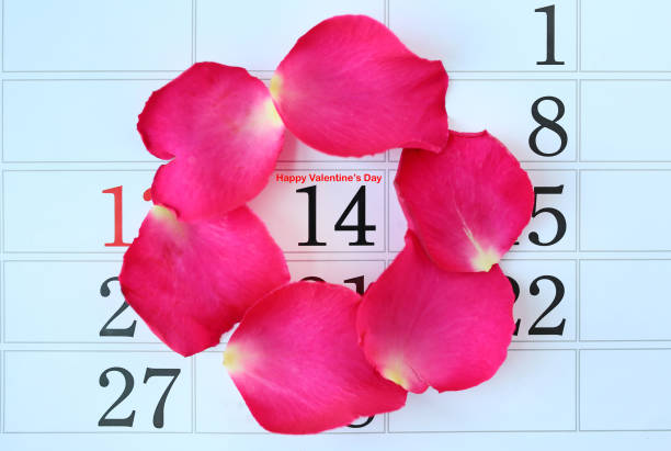 istock Calendar page with pink petals roses 640199524