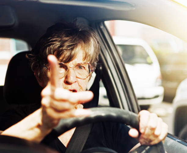 istock Angry old woman driver wagging finger at bad behaviour 640199606