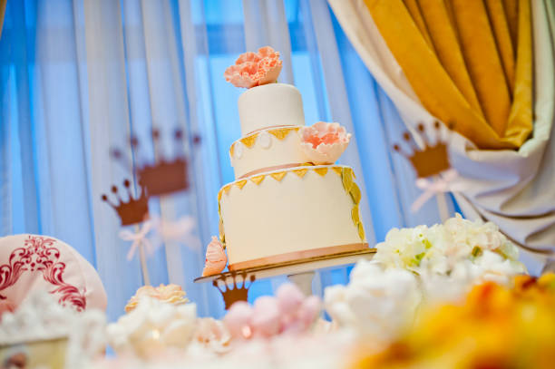 beautiful white big wedding cake with flowers stock photo