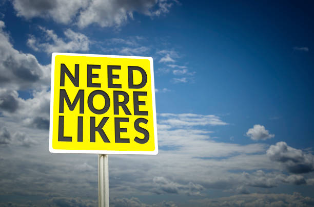 istock Need more likes street sign with cloudy sky background 640200064