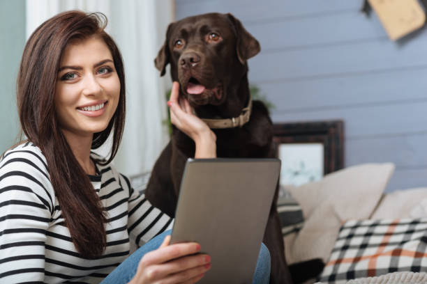 istock Cheerful pretty lady taking a picture with her dog 640200250
