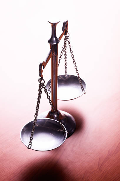 istock Symbolic Scales of Justice brightly lit 640202782