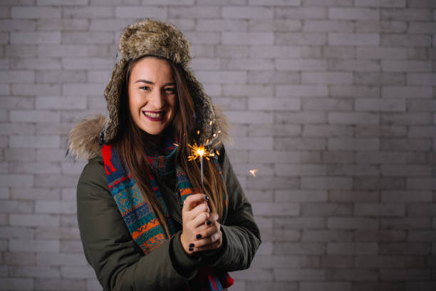 istock Beautiful young woman celebrating with a sprinkle while wearing 640203304