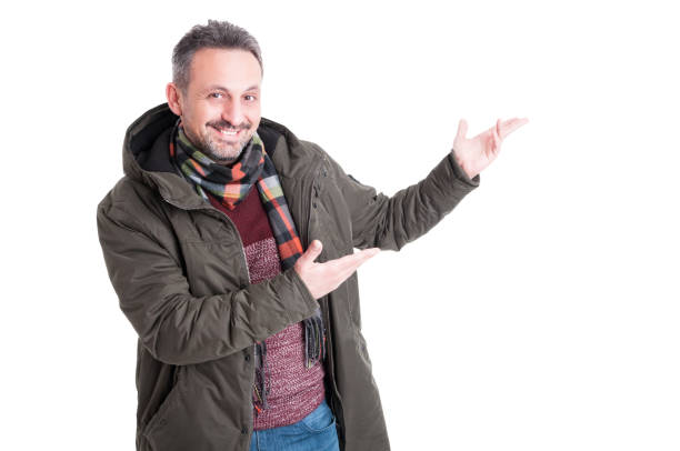 istock Man posing wearing winter showing something 640205692