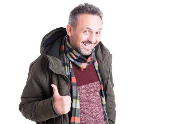 istock Male posing wearing winter jacket showing thumb up gesture 640205732