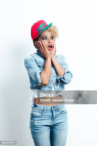 Surprised Afro American Young Woman Stock Photo - Download Image Now - Denim, Jacket, Surprise
