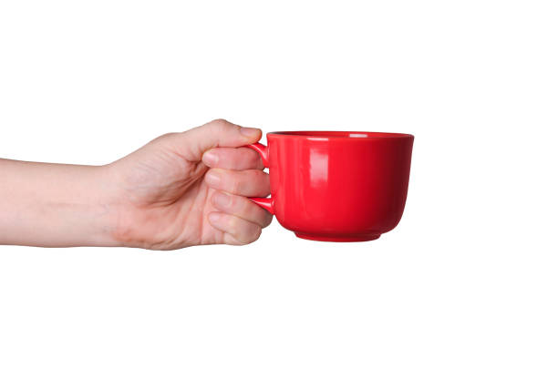 istock Hand holding a cup, isolated on white background 640210184