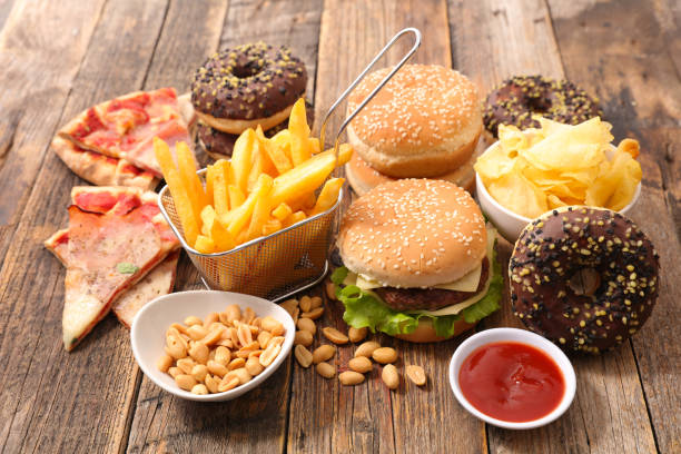assorted junk food assorted junk food unhealthy eating stock pictures, royalty-free photos & images