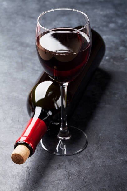 istock Red wine glass and bottle 640212348