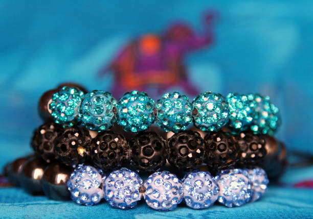 shining jewels on a background of Indian pattern