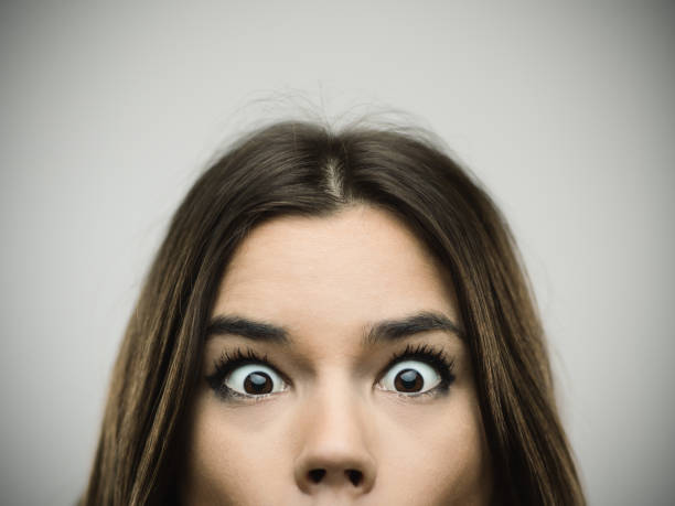 istock Surprised woman smiling against gray background 640215102