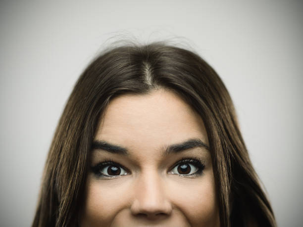 istock Excited woman smiling against gray background 640215262