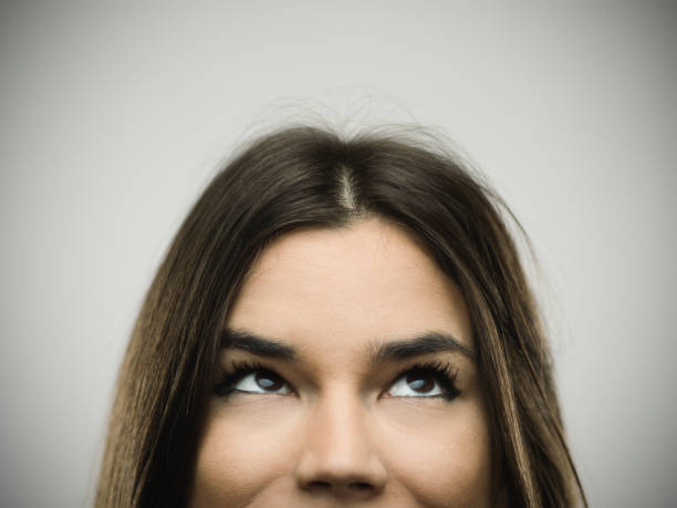 istock Excited woman smiling against gray background 640215434