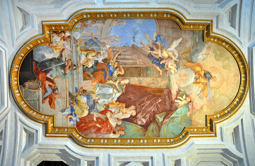 Rome, Italy - March 16, 2016: The fresco Miracle of the Chains on the coffered ceiling was painted by Giovanni Battista Parodi in 1706 in San Pietro in Vincoli church