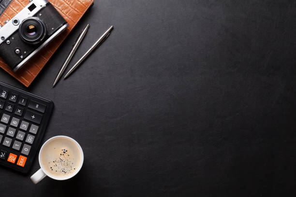 istock Office desk table with camera, supplies and coffee 640218394