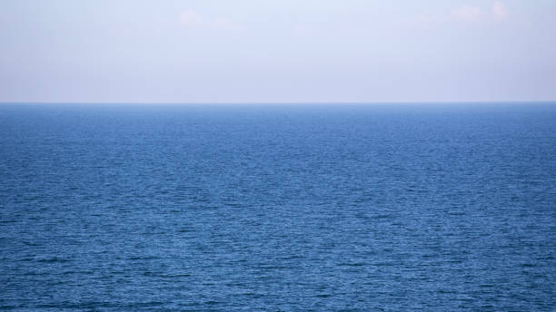 istock blue calm sea and horizon for texture and background 640218534
