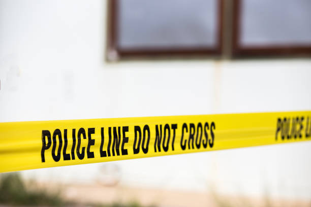 istock police line do not cross protect crime scene 640218614