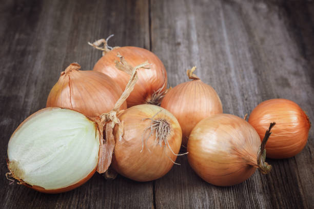 istock Fresh onions on a wooden background 640220972
