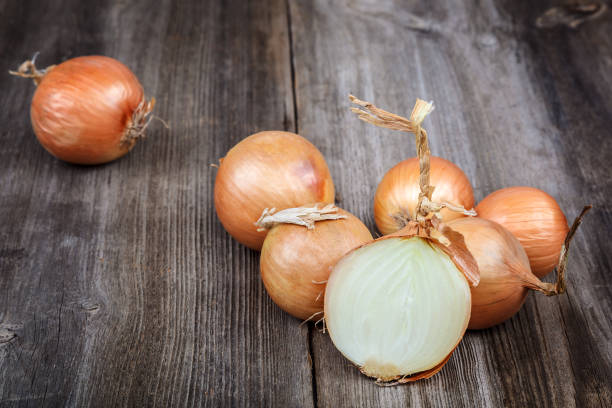 istock Fresh onions on a wooden background 640221158