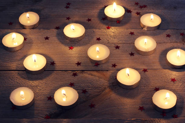 istock candles and confetti on a wooden platform 640221430