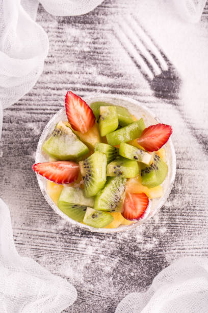 istock Fruit strawberry salad and a kiwi against 640221532