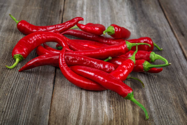 istock Red hot peppers on wooden background 640223182