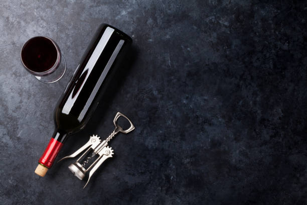istock Red wine glass and bottle 640223368