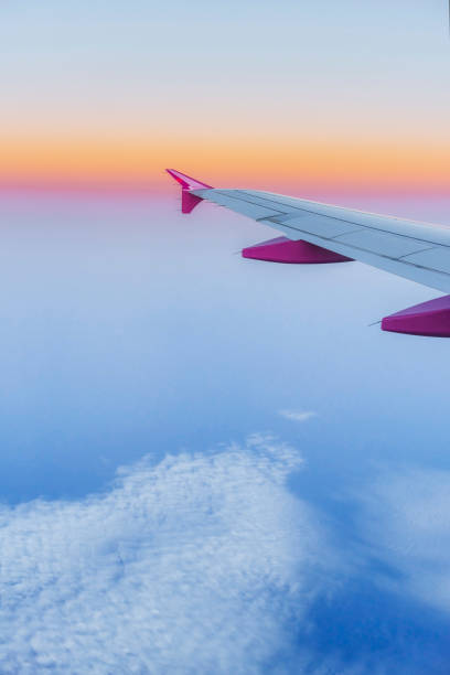 istock Wing aircraft and a view of cumulus clouds. 640226196