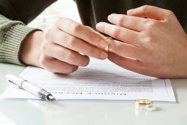 istock Woman taking off wedding ring 640226856