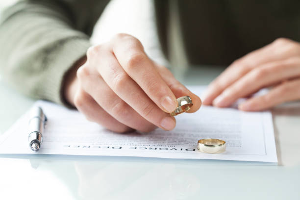 istock Woman taking off wedding ring 640227132